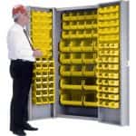 Yellow Hi Density Security Bin Cabinet with a person standing in front on a white background.