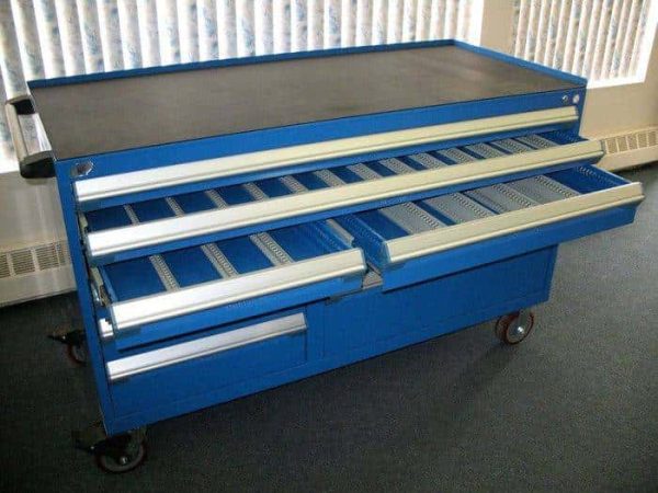 Blue heavy duty multi drawer cabinet in a warehouse setting.