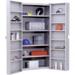 Grey heavy duty deep storage cabinet with the doors opened with various materials inside on a white background.