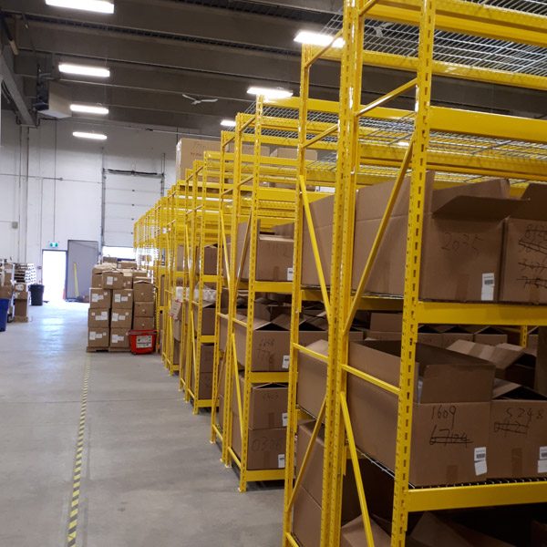 Wide span shelving in a warehouse setting.