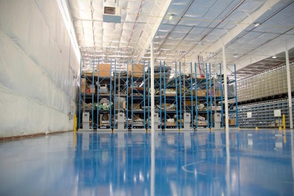 Mobile pallet racking system in a warehouse setting.