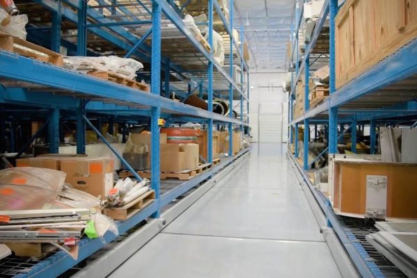 Mobile pallet racking system in a warehouse setting.