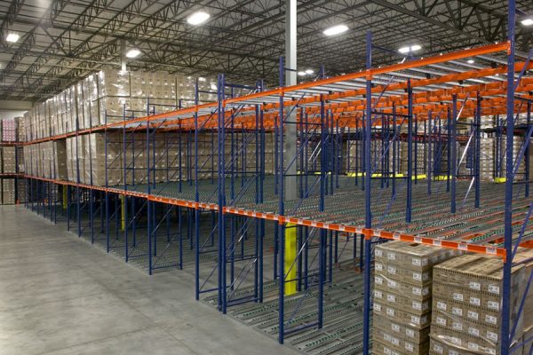 Gravity flow roller racks in a warehouse setting.